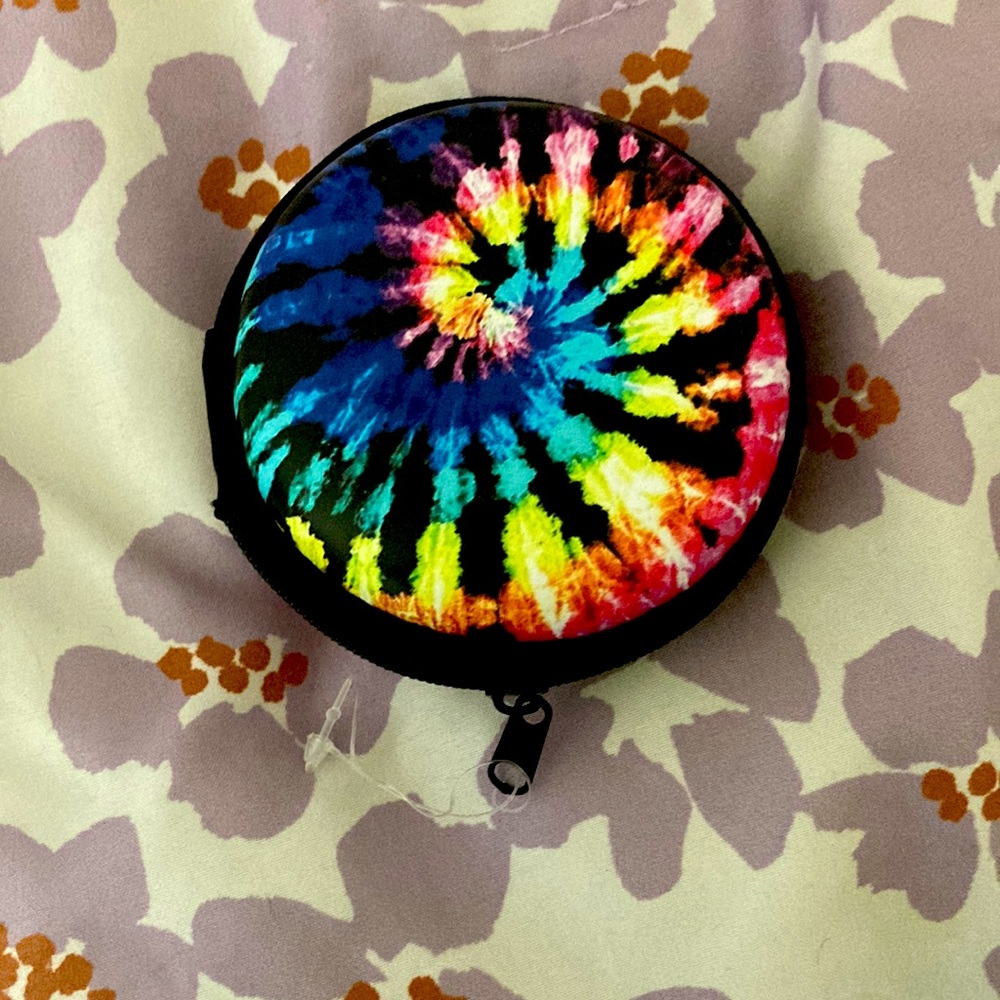 Its a small zip up department and its tiedye